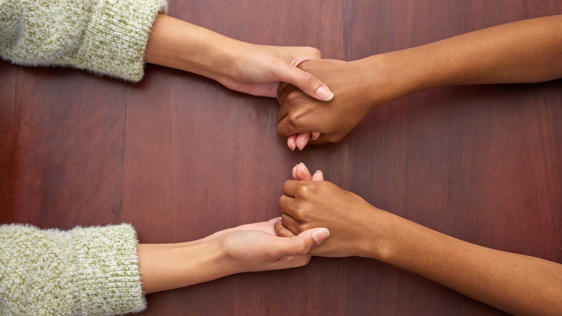 women-holding-hands